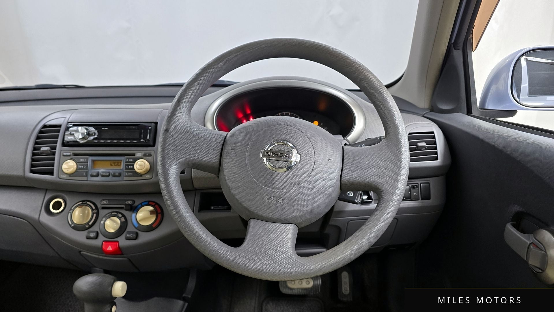 Nissan 마치 2002 — миниатюра 13